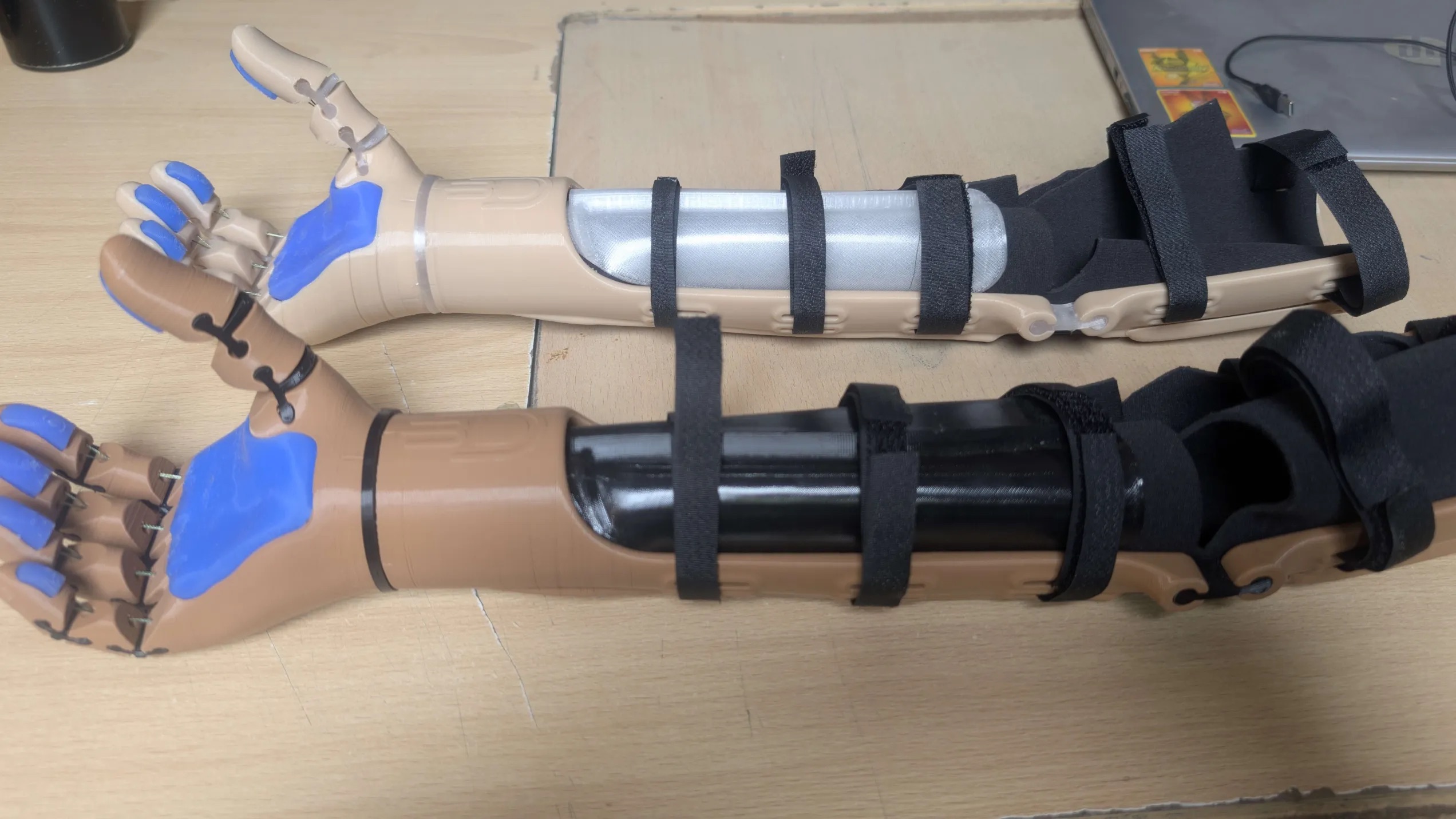 Close-up of the two replacement arms side by side