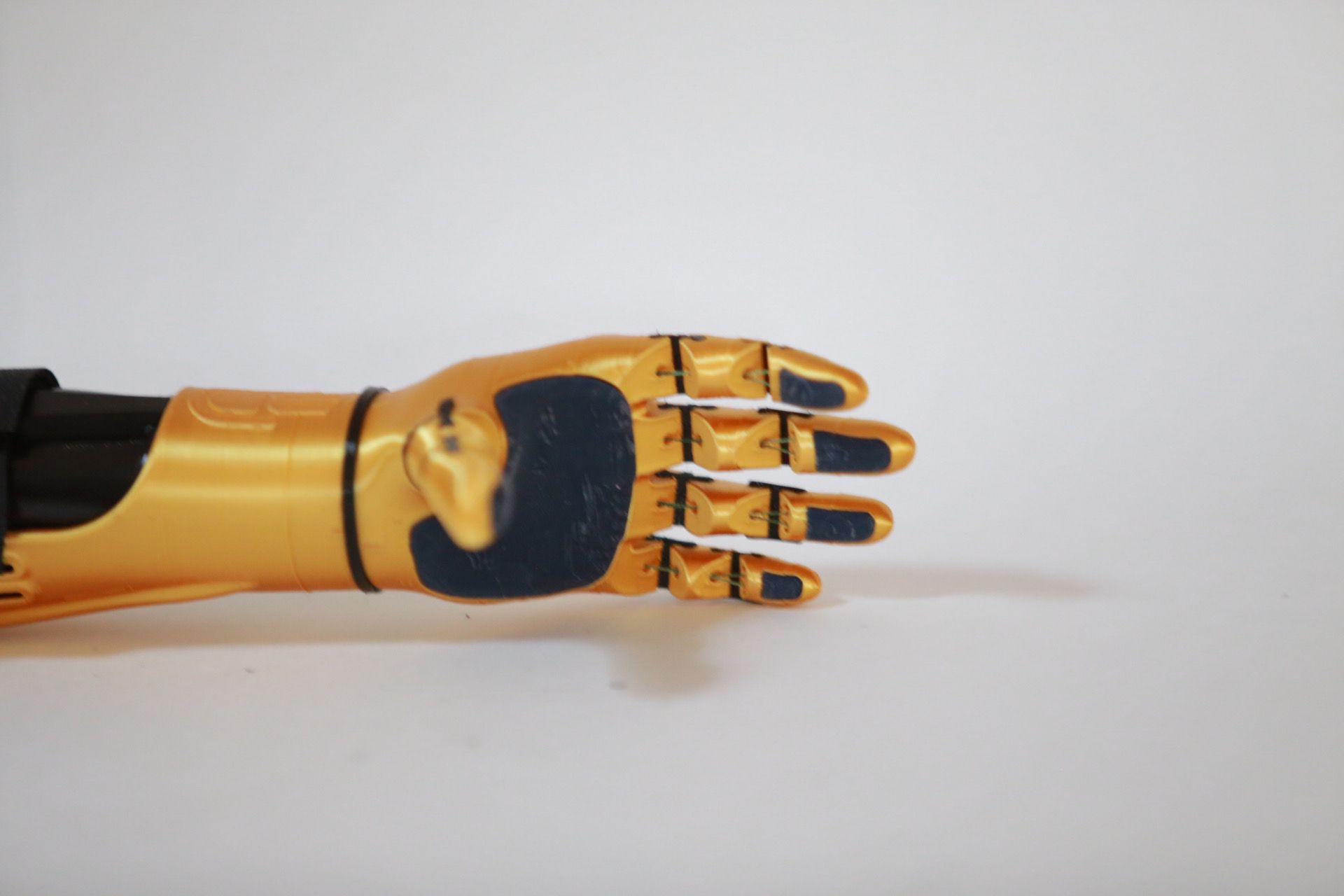 Palm-side view of the finished arm, finger detail and TPU pads