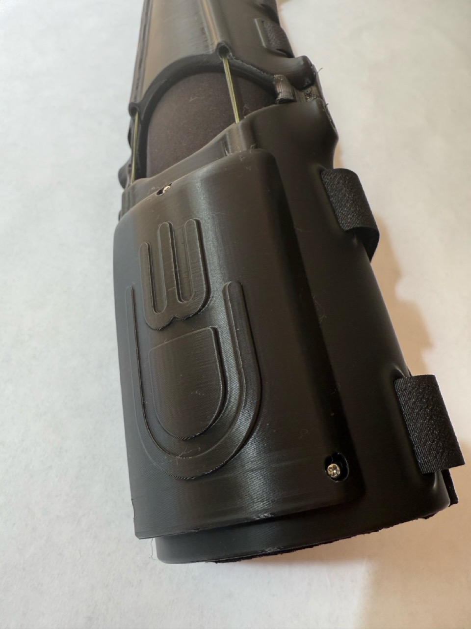 Close-up of the e-NABLE logo embossed into the wrist connector piece
