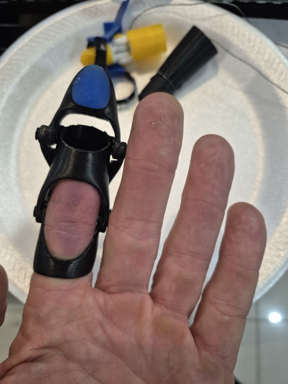 S.P. trying the first black prototype on his ring finger to test the fit