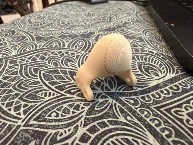 The solid plastic distal tip printed separately, sent later to replace the silicone version for guitar use