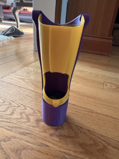 The finished purple and yellow Kinetic Arm standing upright, showing the modified inner cover