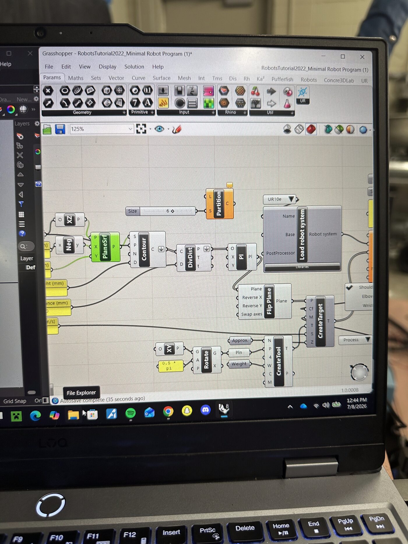 Grasshopper interface on a laptop in the RECAST Lab showing the parametric robot pipeline with UR10e robot definition, Pufferfish plugin, and toolpath nodes